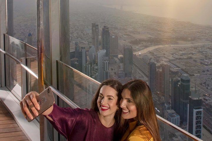 Experience breathtaking views from the 125th floor of Burj Khalifa capturing unforgettable moments while savoring a delicious 3-course meal at the exclusive Rooftop Burj Club. Perfect for memories!